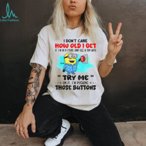 Minion red button I don’t care how old I get if I’m in a and see a toy with me try me on it I’m pushing the buttons shirt