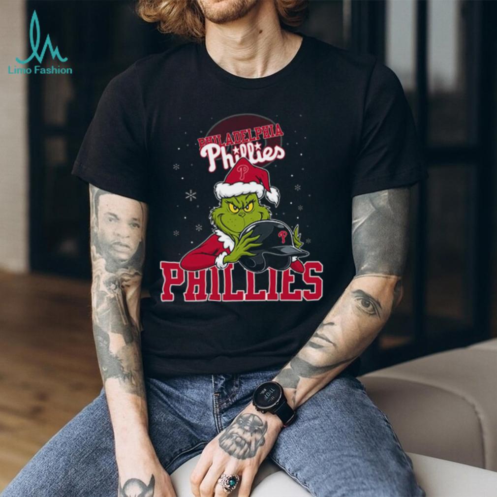 MLB Philadelphia Phillies Christmas Grinch Helmets Baseball Logo T Shirt MLB Philadelphia Phillies Christmas Grinch Helmets Baseball Logo T Shirt