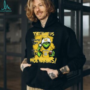 Michigan Wolverines Custom Name Grinch Holiday Tee – NCAA Football Christmas Shirt – “They Hate Us Because They Ain’t Us” Gift for Fans