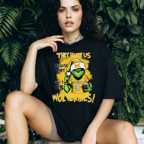Michigan Wolverines Custom Name Grinch Holiday Tee – NCAA Football Christmas Shirt – “They Hate Us Because They Ain’t Us” Gift for Fans