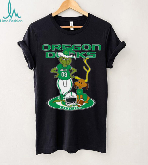 Oregon Ducks Custom Name Grinch with Dog Christmas Shirt – NCAA Football Tee – Personalized Holiday Gift for Fans & Supporters