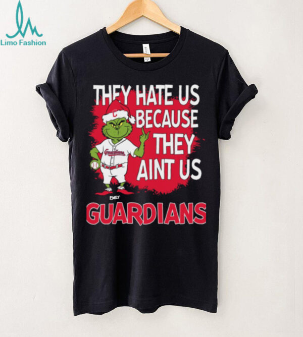 Personalized Cleveland Guardians Grinch Christmas Tee, Funny Santa Baseball Shirt with Quote They Hate Us Ain’t Us, MLB Fan Gift