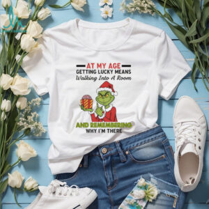 Funny Grinch Santa hat at my age getting lucky means walking into a room and remembering Merry Christmas shirt