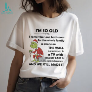 Grinch Santa hat I’m so old I remember one bathroom for the whole family a phone on the wall Christmas shirt
