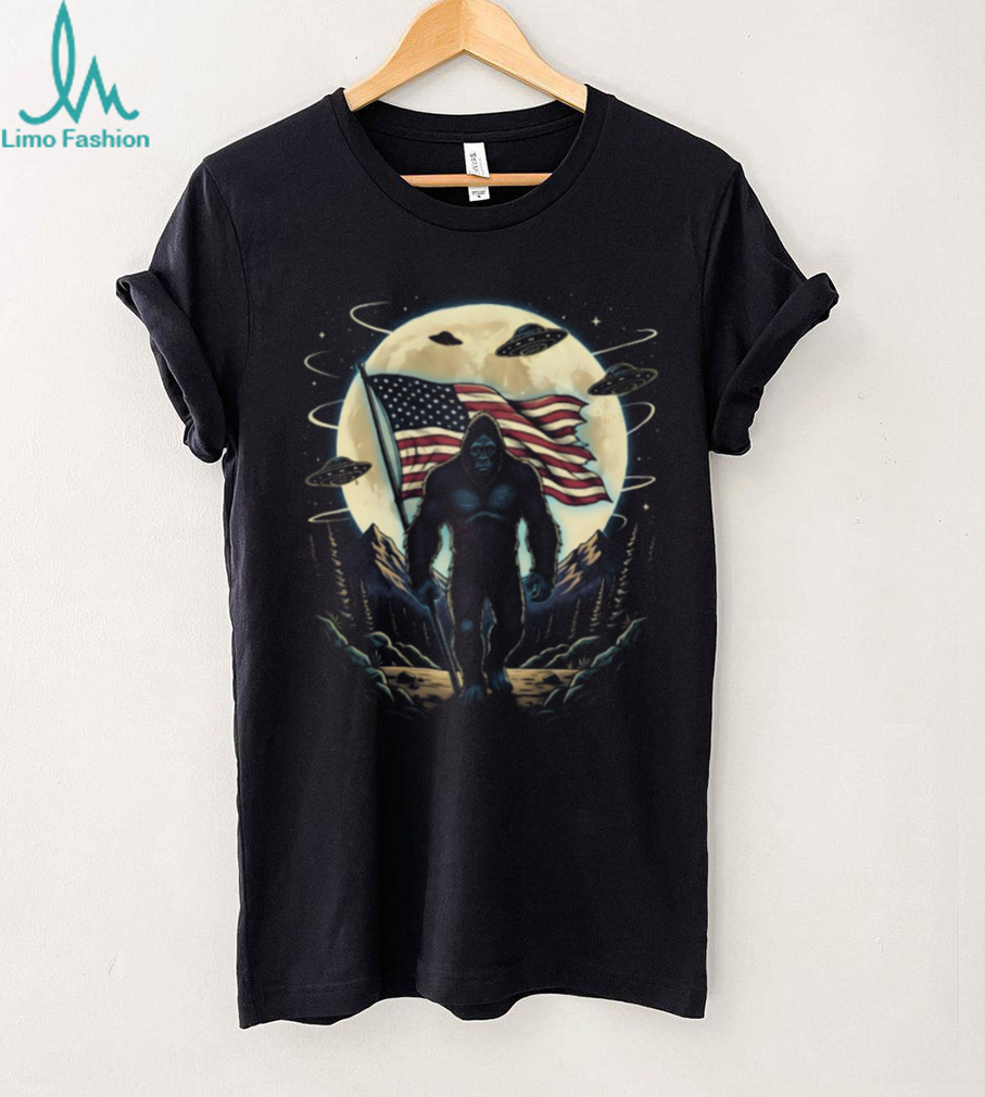 Patriotic Bigfoot American Flag T Shirt Sasquatch & UFO Moon Graphic Tee Patriotic Bigfoot American Flag T Shirt Sasquatch & UFO Moon Graphic Tee