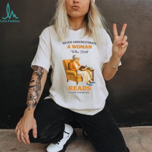 Never Underestimate A Woman Who Still Reads In Her Seventies Graphic T shirt