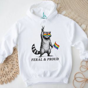Feral and proud racoon with pride sunglasses and rainbow flag shirt