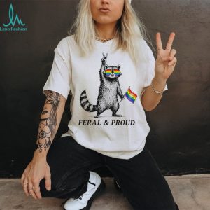 Feral and proud racoon with pride sunglasses and rainbow flag shirt