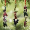 personalized Christmas ornament featuring the Grinch playing American football against other players personalized Christmas ornament featuring the Grinch playing American football against other players
