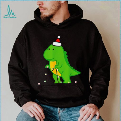 Dinosaur putting up string lights Christmas shirt