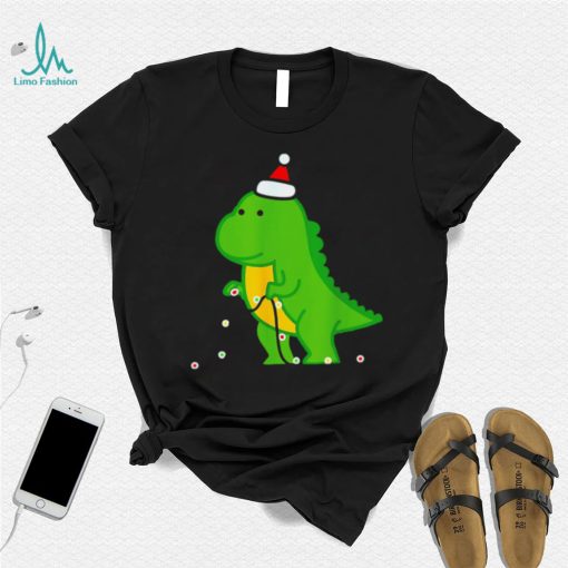 Dinosaur putting up string lights Christmas shirt