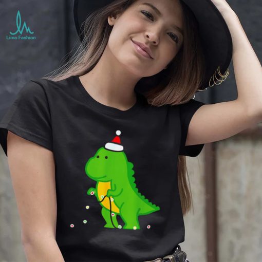 Dinosaur putting up string lights Christmas shirt