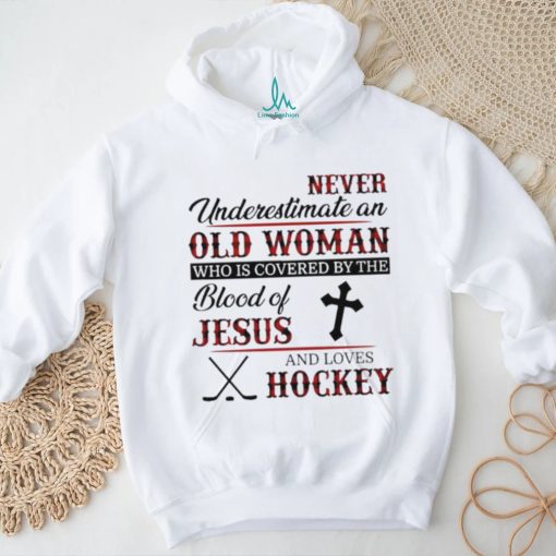 Never underestimate an old woman who is covered by the blood of jesus and loves hockey shirt