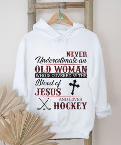 Never underestimate an old woman who is covered by the blood of jesus and loves hockey shirt