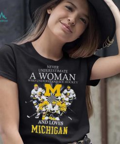 Never underestimate a woman who understands ice hockey and loves michigan wolverines shirt