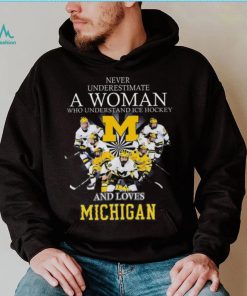 Never underestimate a woman who understands ice hockey and loves michigan wolverines shirt