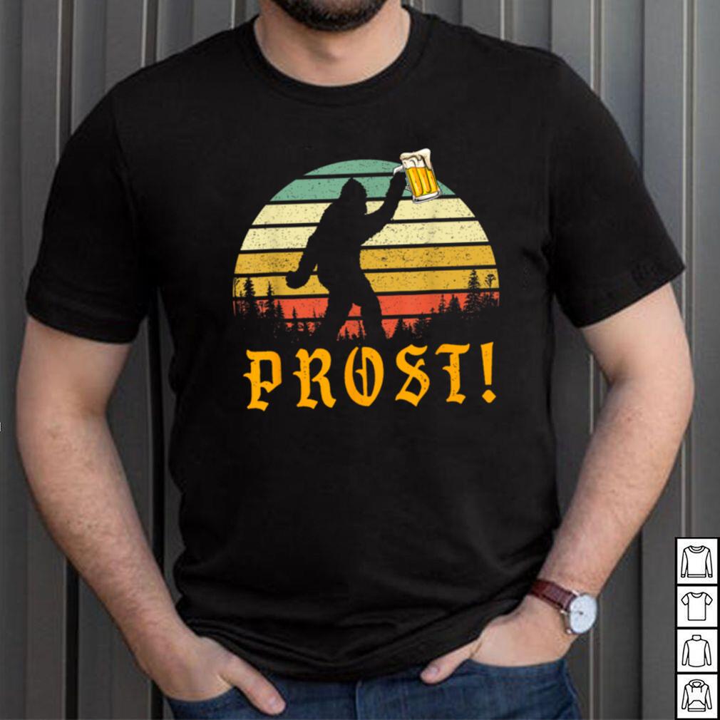 https://img.limotees.com/photos/2023/09/Vintage-PROST-Bigfoot-Drinking-Beer-German-Oktoberfest-T-Shirt0.jpg