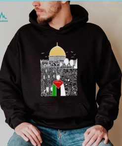 A boy wearing Free Palestine flag shirt