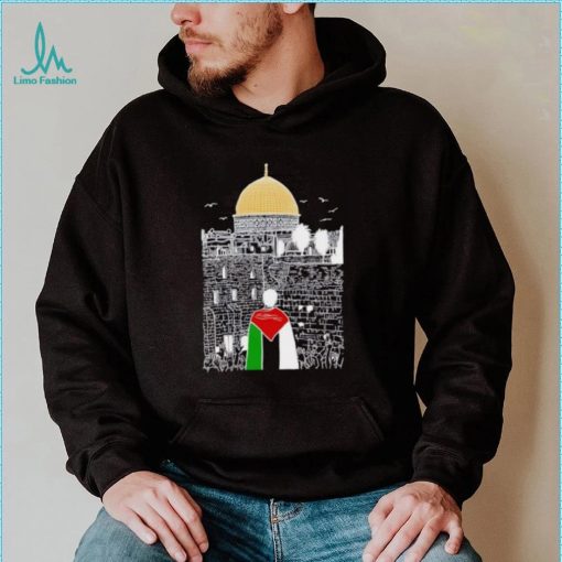 A boy wearing Free Palestine flag shirt