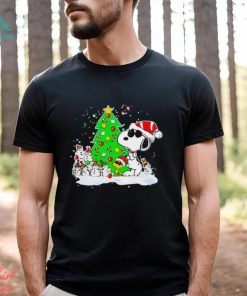 Snoopy and snowman next to the pine tree Christmas shirt