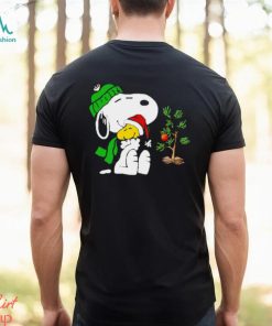 Snoopy hugs his Christmas day Woodstock shirt