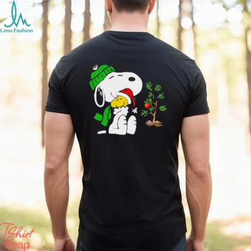 Snoopy hugs his Christmas day Woodstock shirt