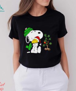 Snoopy hugs his Christmas day Woodstock shirt