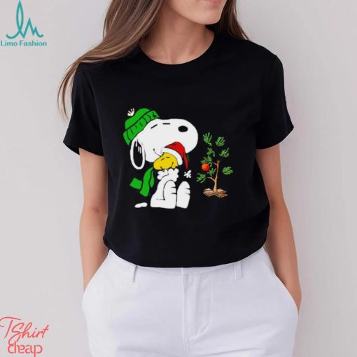 Snoopy hugs his Christmas day Woodstock shirt