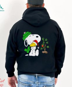 Snoopy hugs his Christmas day Woodstock shirt