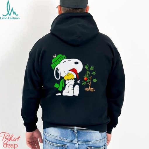 Snoopy hugs his Christmas day Woodstock shirt