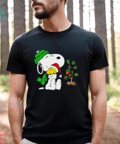 Snoopy hugs his Christmas day Woodstock shirt