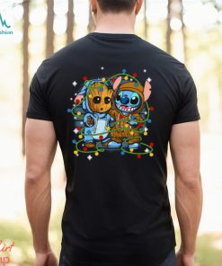 Stitch And Baby Groot Christmas Lights Essential Shirt, hoodie, sweater, long sleeve and tank top Stitch And Baby Groot Christmas Lights Essential Shirt
