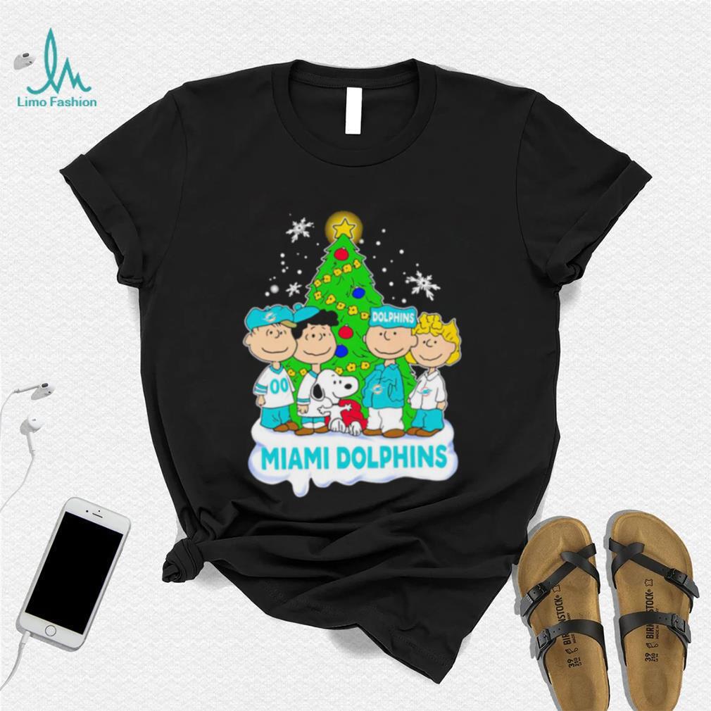Happy Merry Christmas Peanuts Christmas tree Miami Dolphins football logo gift shirt Happy Merry Christmas Peanuts Christmas tree Miami Dolphins football logo gift shirt
