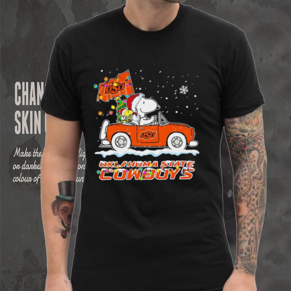 Happy Merry Christmas Snoopy drive a car Oklahoma State Cowboys logo flag gift shirt Happy Merry Christmas Snoopy drive a car Oklahoma State Cowboys logo flag gift shirt