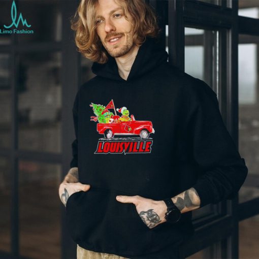 Happy Merry Christmas The Grinch drive a car Louisville Cardinals football logo flag gift shirt