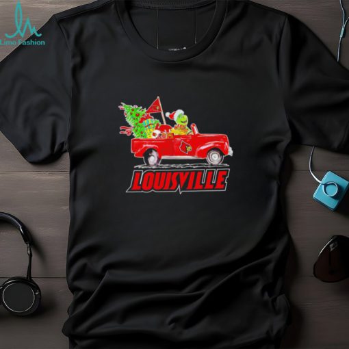 Happy Merry Christmas The Grinch drive a car Louisville Cardinals football logo flag gift shirt