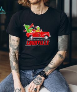 Happy Merry Christmas The Grinch drive a car Louisville Cardinals football logo flag gift shirt