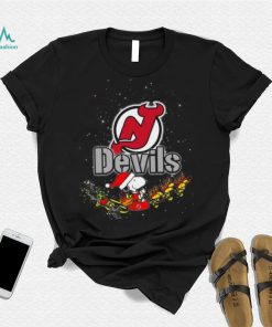 New Jersey Devils NHL Santa Snoopy and Woodstock Christmas T Shirt, hoodie, sweater, long sleeve and tank top New Jersey Devils NHL Santa Snoopy and Woodstock Christmas T Shirt