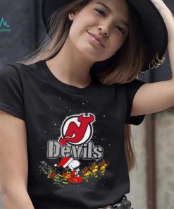 New Jersey Devils NHL Santa Snoopy and Woodstock Christmas T Shirt, hoodie, sweater, long sleeve and tank top New Jersey Devils NHL Santa Snoopy and Woodstock Christmas T Shirt