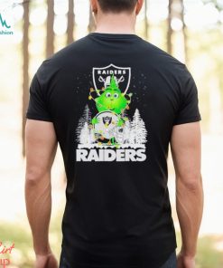 The Baby Grinch hugging Las Vegas Raiders helmet snowy forest Christmas shirt