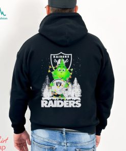 The Baby Grinch hugging Las Vegas Raiders helmet snowy forest Christmas shirt