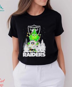 The Baby Grinch hugging Las Vegas Raiders helmet snowy forest Christmas shirt