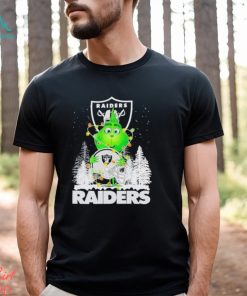 The Baby Grinch hugging Las Vegas Raiders helmet snowy forest Christmas shirt