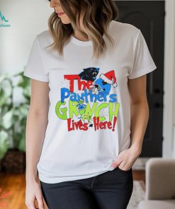 The Carolina Panthers football Grinch lives here Merry Christmas shirt