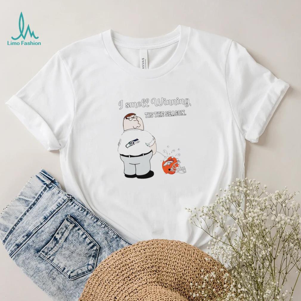 Peter Griffin Seattle Seahawks I smell winning tis the season peeing on Denver Broncos helmet shirt Peter Griffin Seattle Seahawks I smell winning tis the season peeing on Denver Broncos helmet shirt
