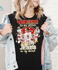 Top san Francisco 49ers team in my veins jesus in my heart shirt, hoodie, sweater, long sleeve and tank top Top san Francisco 49ers team in my veins jesus in my heart shirt