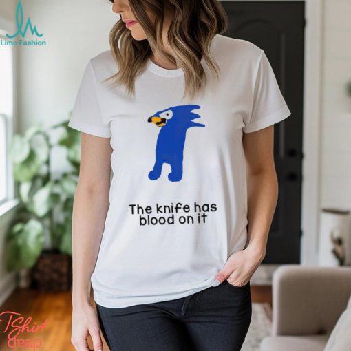 The knife has blood on it shirt