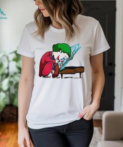 Joker playing the piano in the style of Peanuts shirt