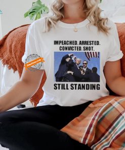 Donald Trump impeached arrested convicted shot still standing shirt