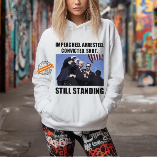 Donald Trump impeached arrested convicted shot still standing shirt
